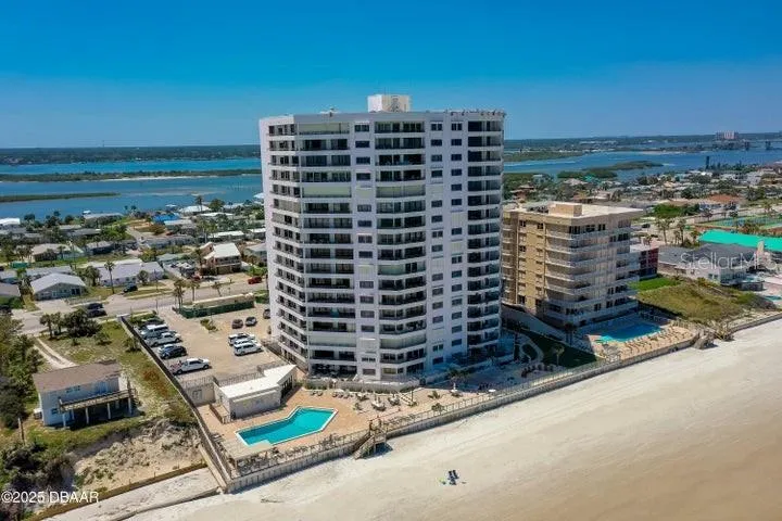 The property is set in a quiet, residential stretch of Daytona Beach Shores, surrounded by colorful beach homes and convenient local amenities.