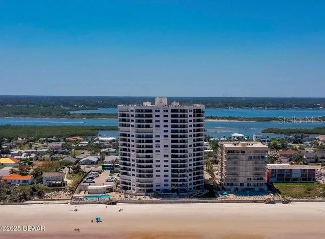 Steps from the sand, the building features private pool areas, and immediate beach access for the ultimate coastal lifestyle.