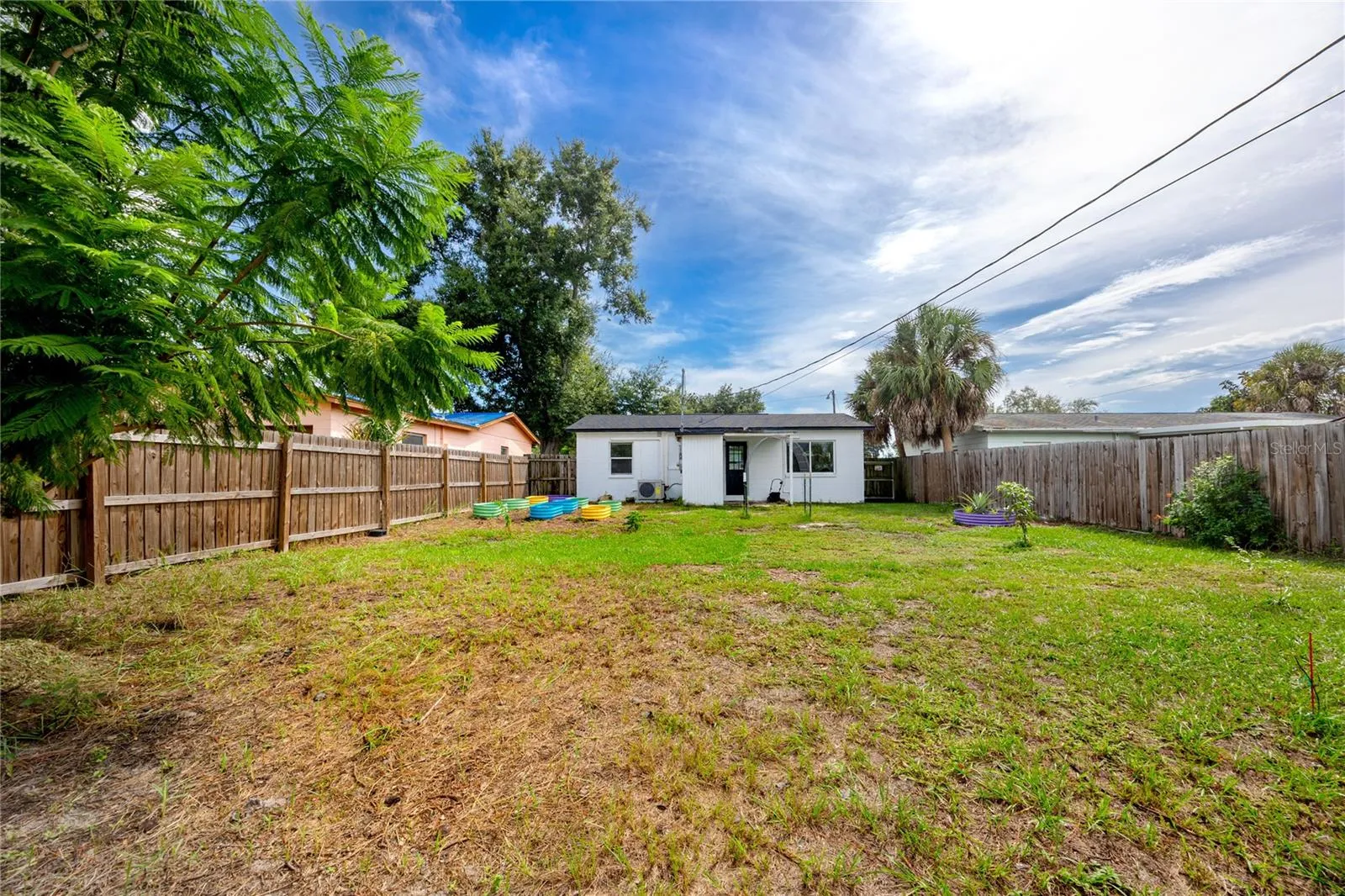 View of the rear of the house with backyard