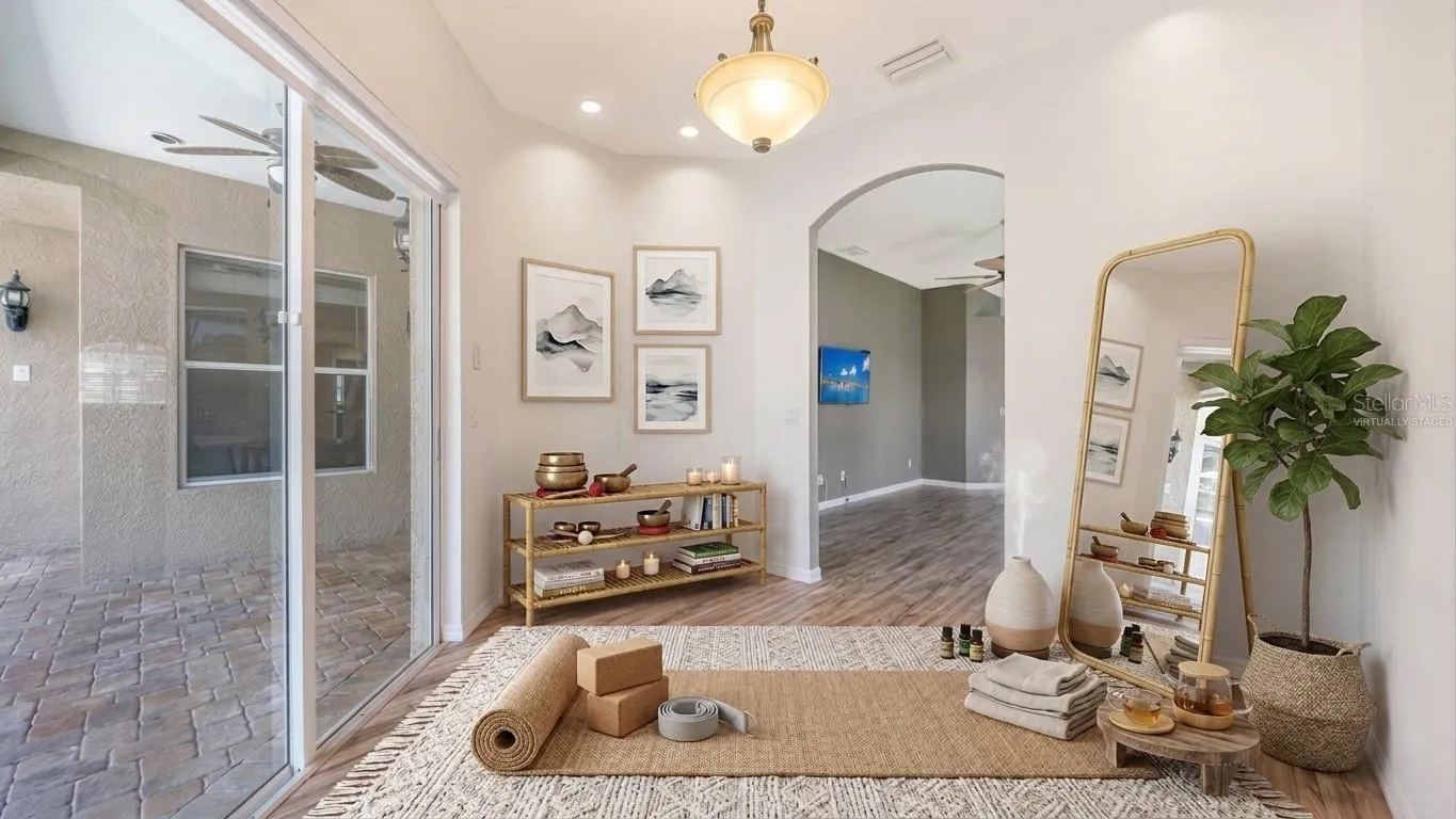 virtually staged Space off Primary bedroom could be used as a yoga studio