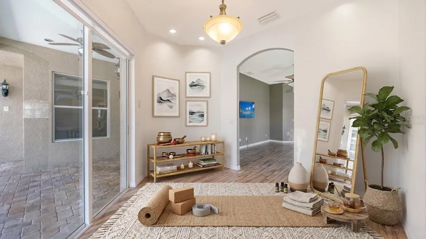 virtually staged Space off Primary bedroom could be used as a yoga studio