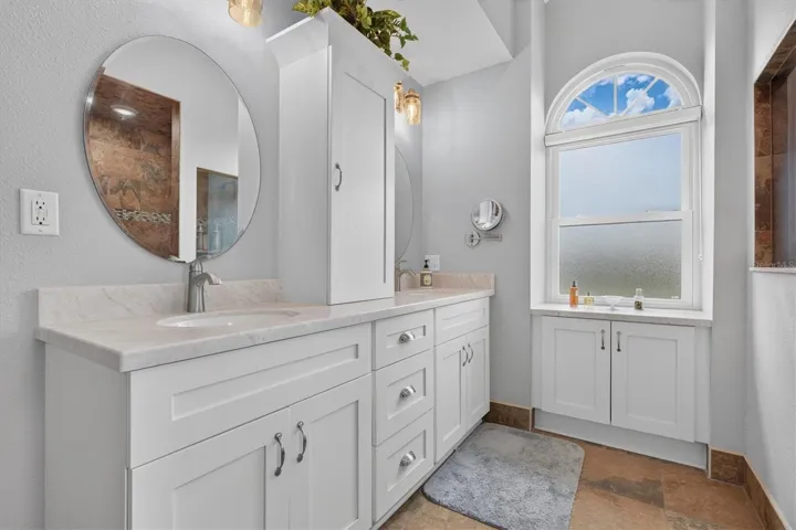 Primary Bathroom with Dual Sinks & Tower