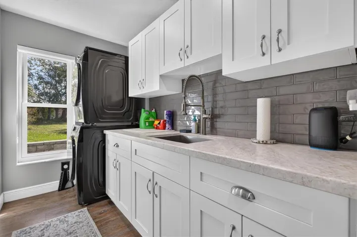 Updated Laundry Room with lots of Storage, Counter Space and a Sink