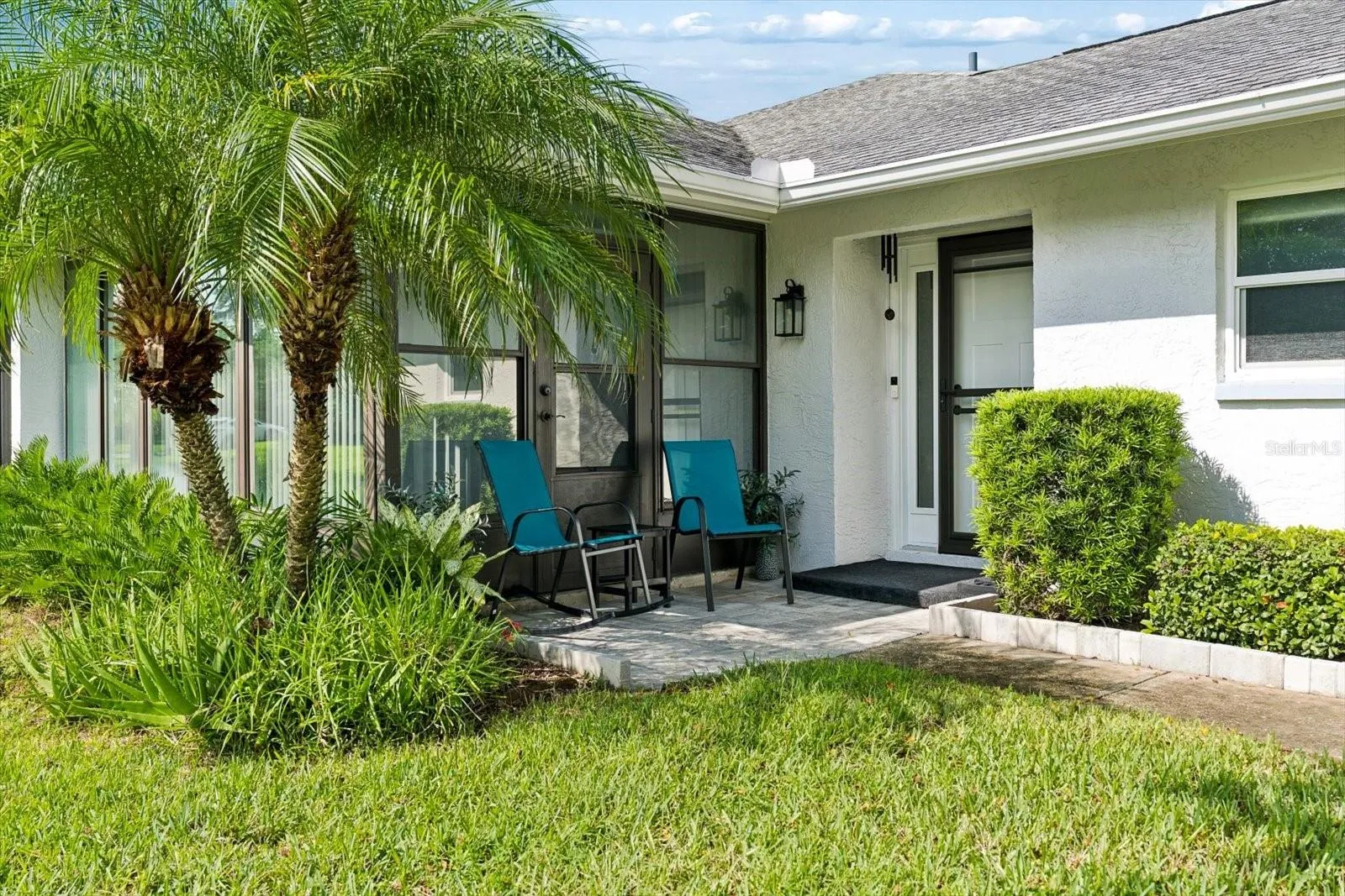 Private front entrance with patio/courtyard.