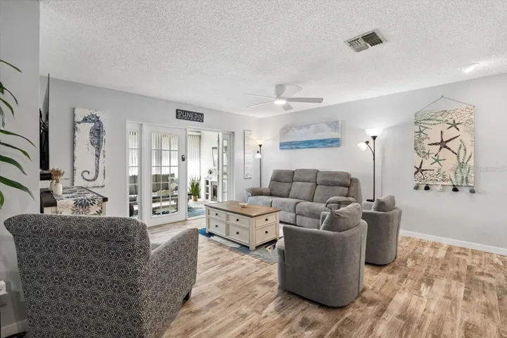 Living Room with french doors leading to enclosed lanai