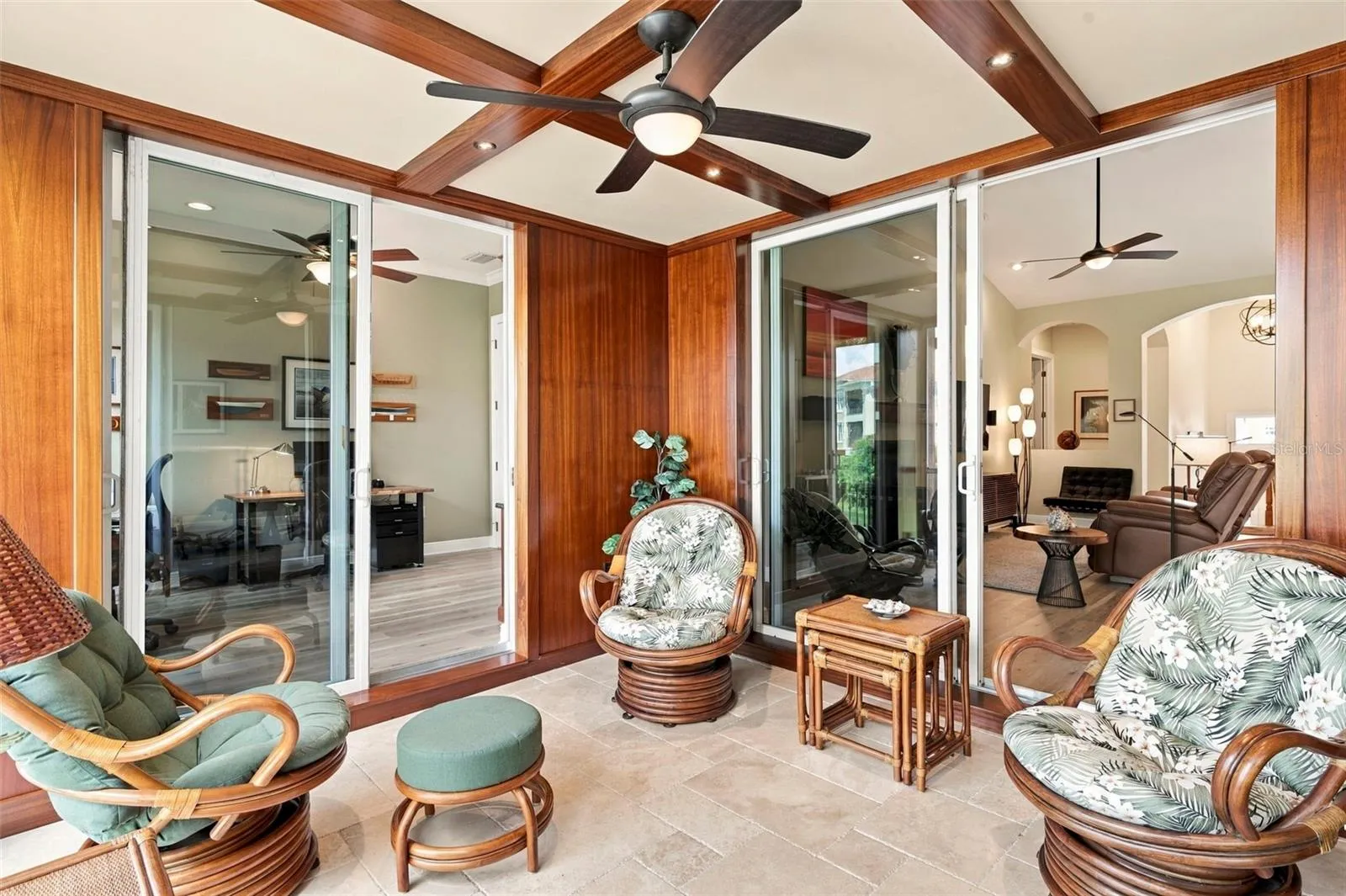 One of a kind outdoor space showcases beautiful African Mahogany trim, teak wall panels, and an impressive 14 coats of varnish, reflecting the craftsmanship