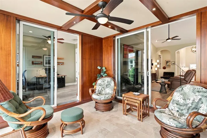 One of a kind outdoor space showcases beautiful African Mahogany trim, teak wall panels, and an impressive 14 coats of varnish, reflecting the craftsmanship