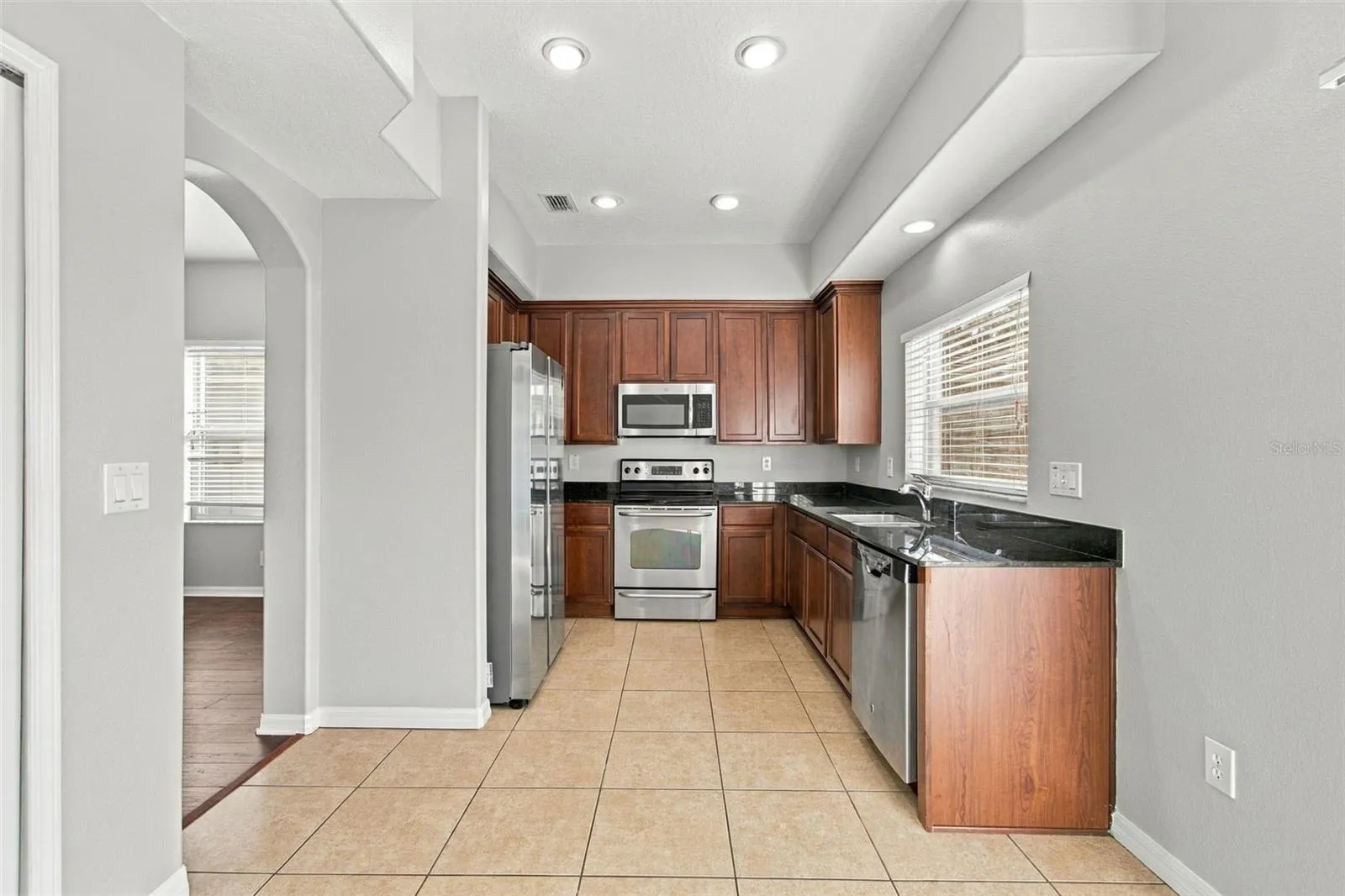From Dining Room to Kitchen with window view to backyard to water view