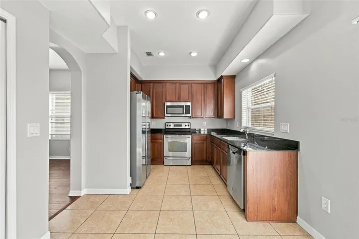 From Dining Room to Kitchen with window view to backyard to water view