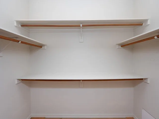 walk in closet in primary bedroom