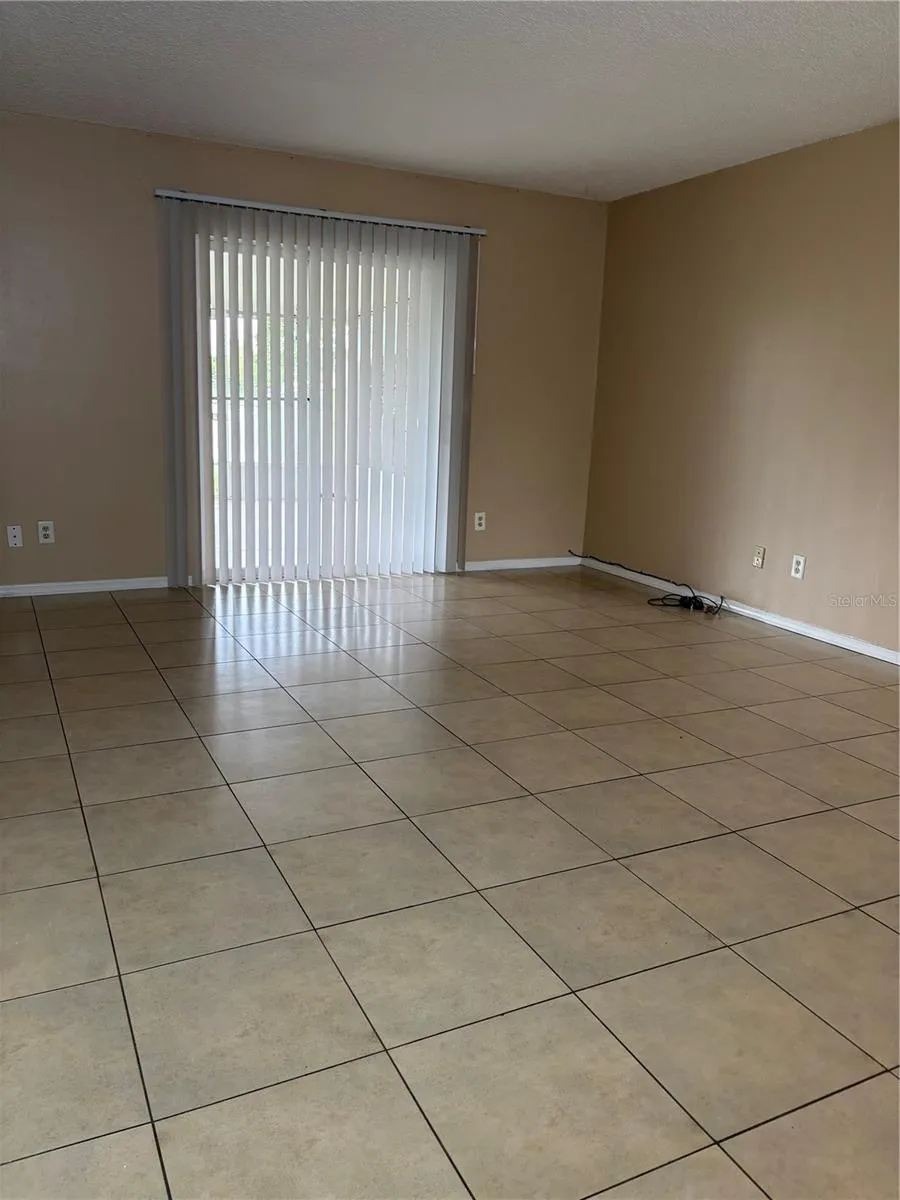 Living room and sliding door to enter Rear Porch.