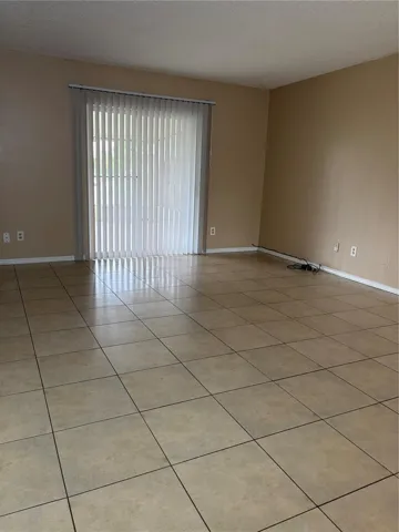 Living room and sliding door to enter Rear Porch.