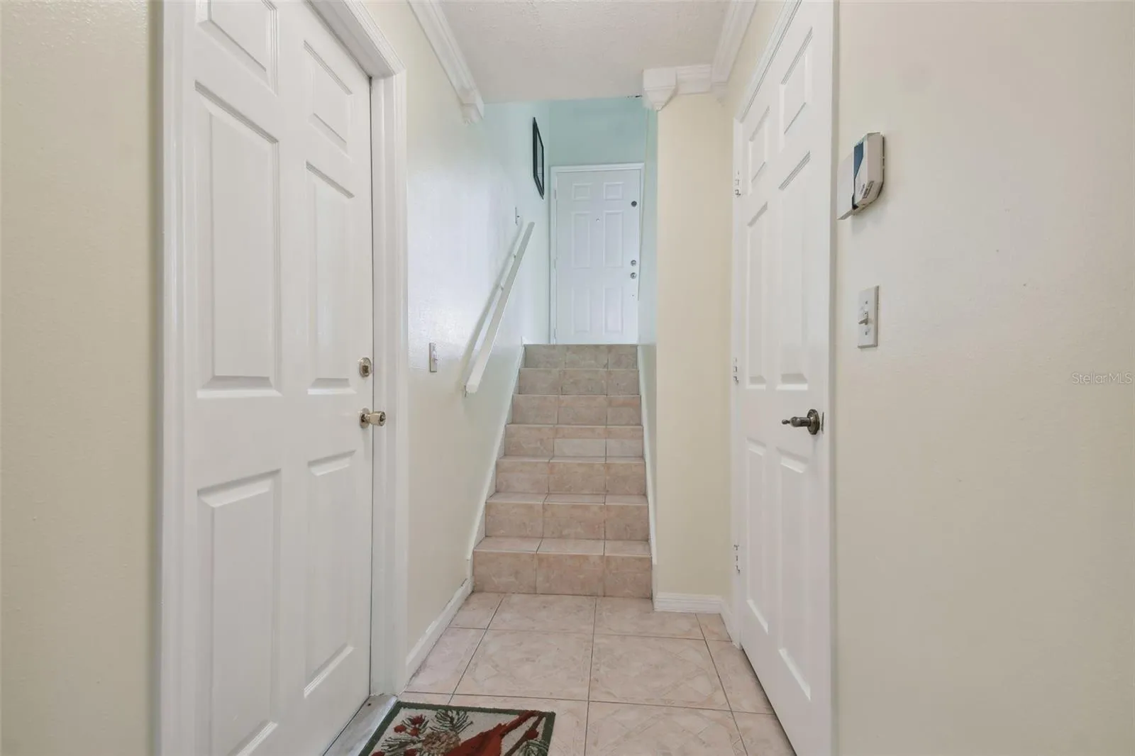 garage door and lower level leading to front door