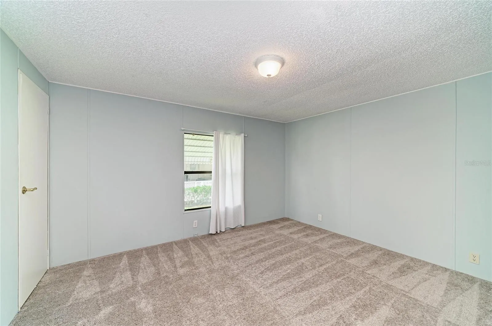 Bedroom 2 with newer carpet. Good size closet