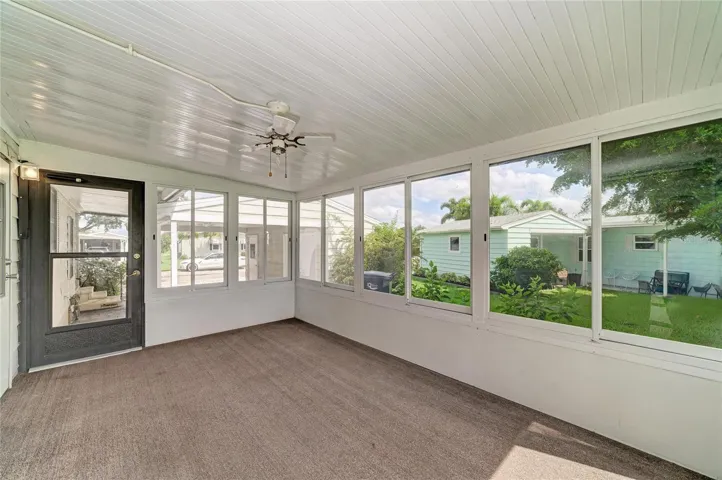 View of sunroom looking out to carport