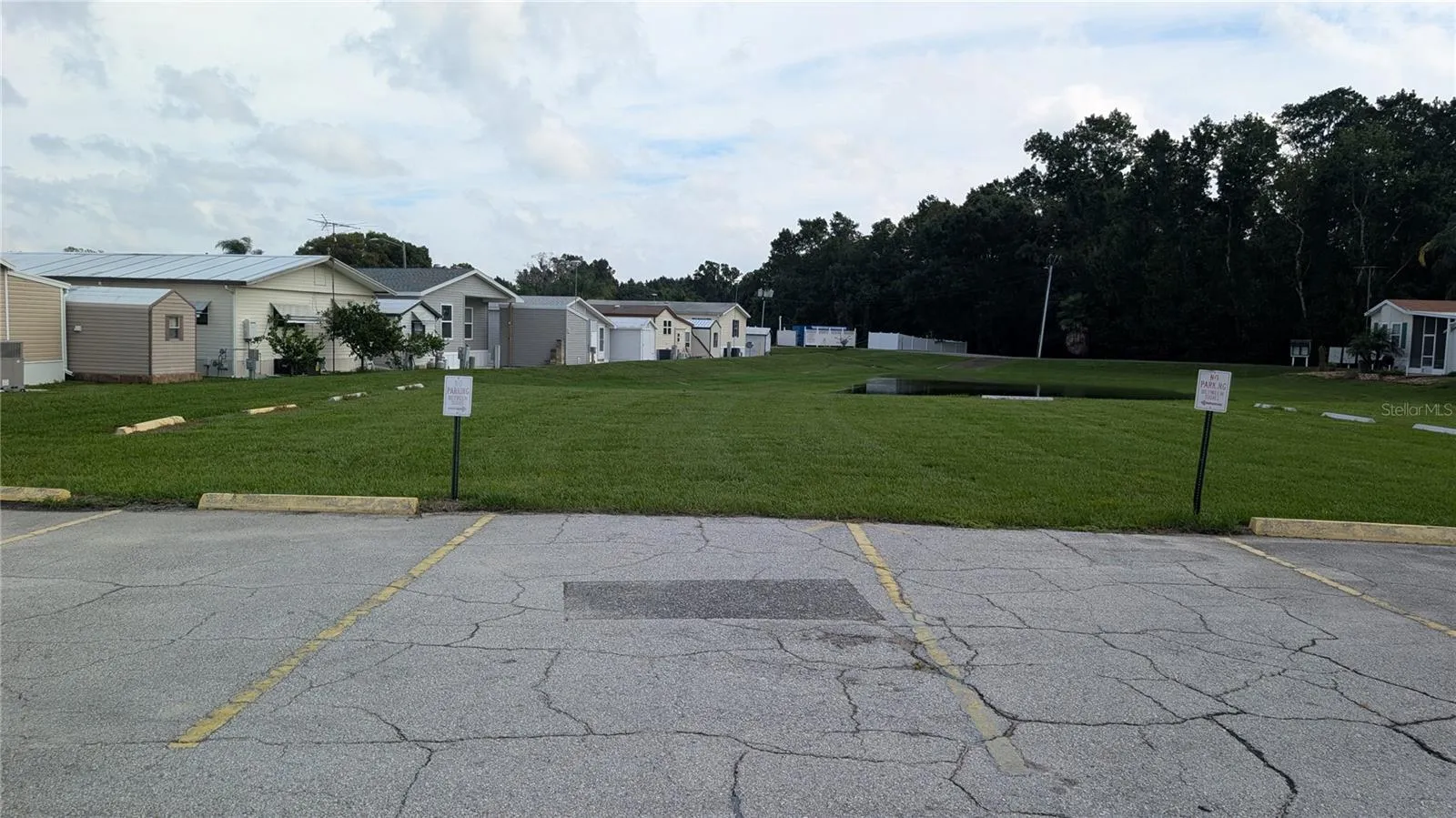 OVER LOOKING REAR OF HOUSE (WHITE SHED IN MIDDLE)