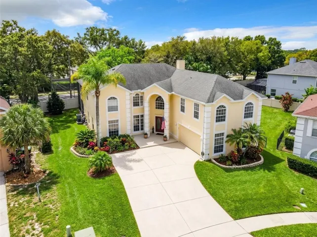 Aerial view of the property entrance and roofline.