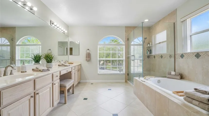 Master bathroom featuring a soaking tub.