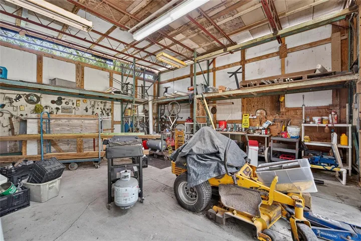 Rear Shed/shop/barn is 25 x 25 with 12' ceiling.