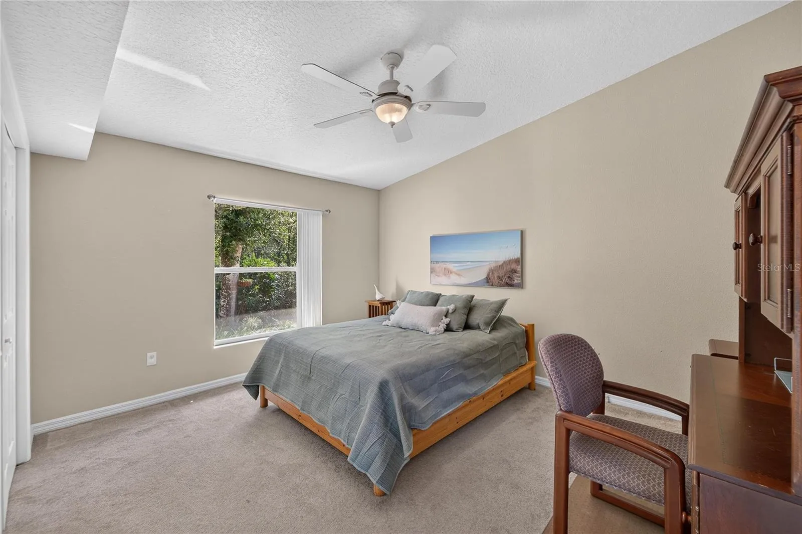 Guest room has an overhead fan