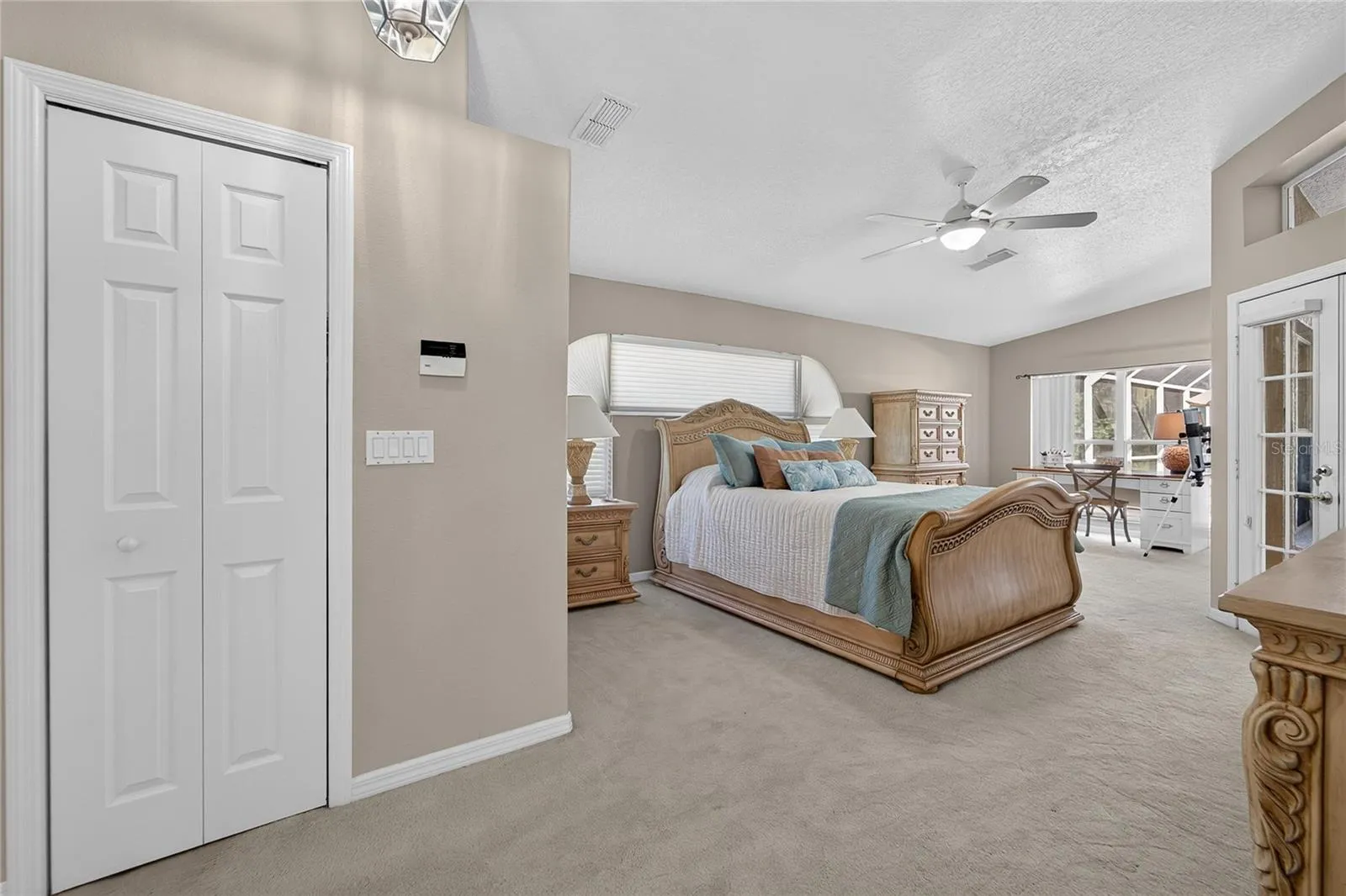 Entrance to huge primary bedroom with a seating area