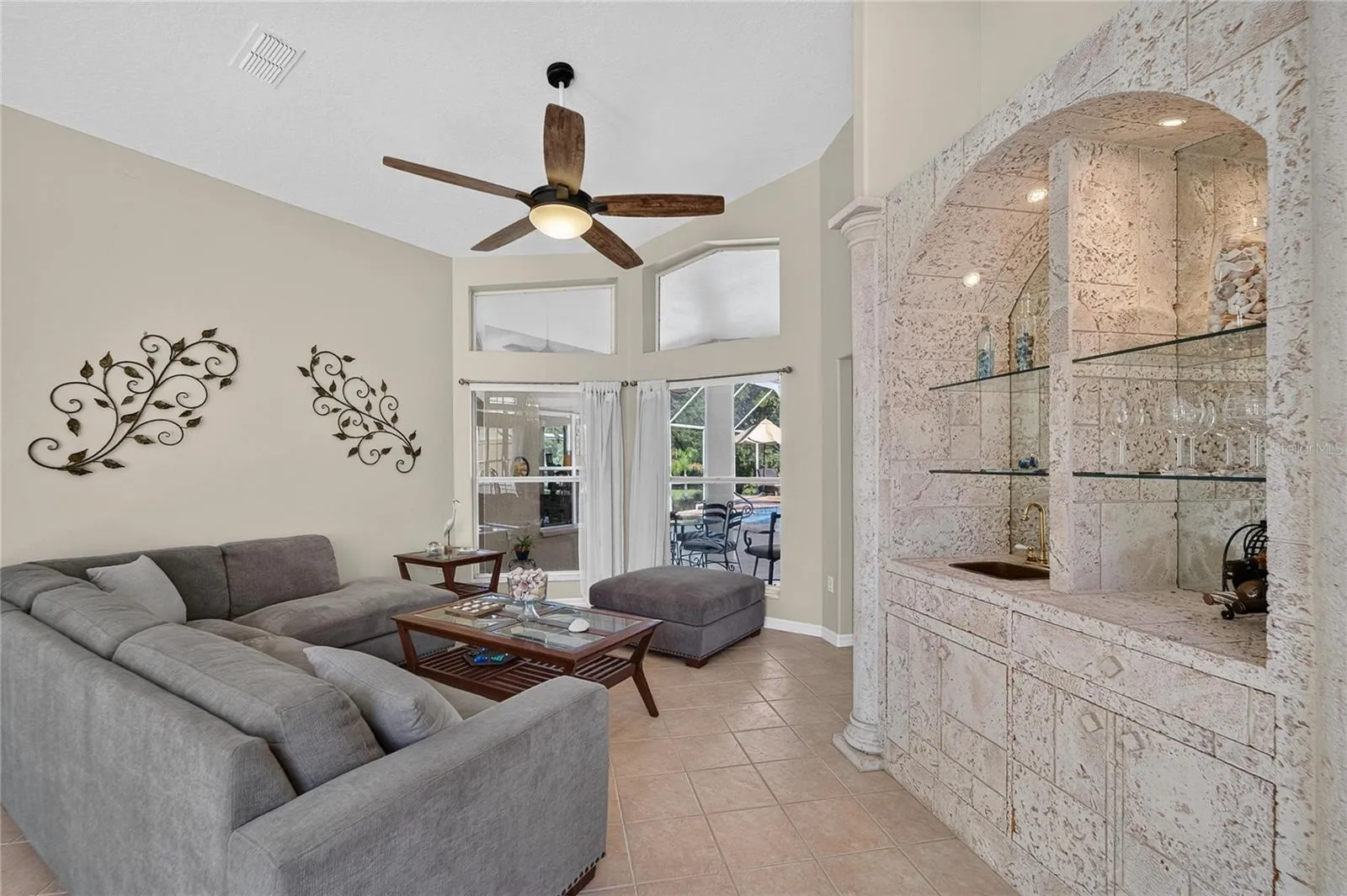 Formal living room looks over the pool