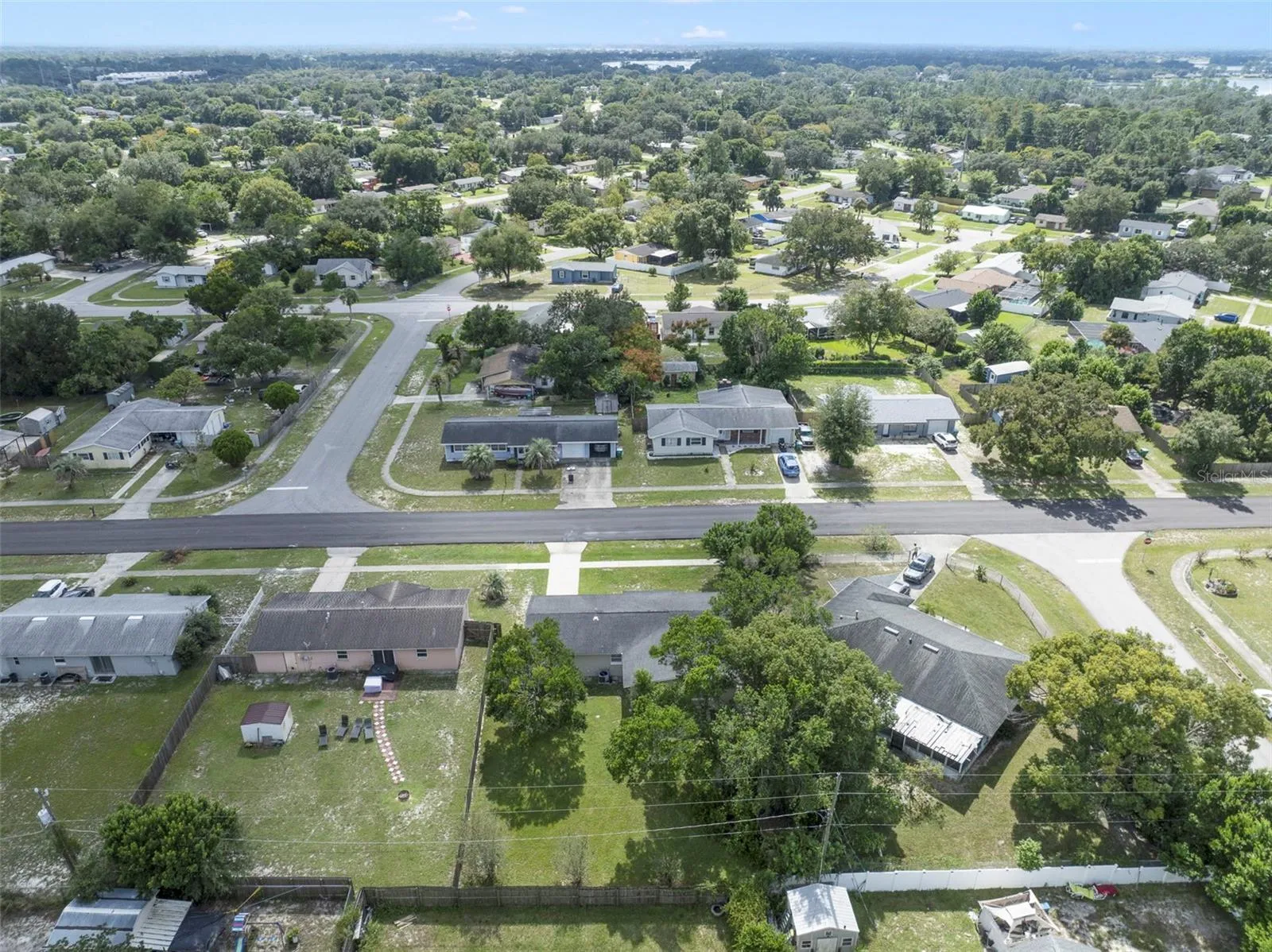 Drone shot of the property and the yard