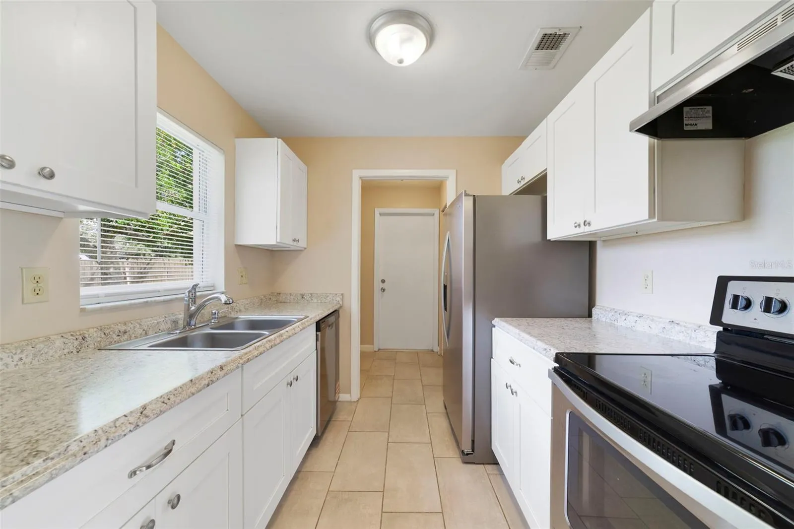 Kitchen features stainless steel appliances
