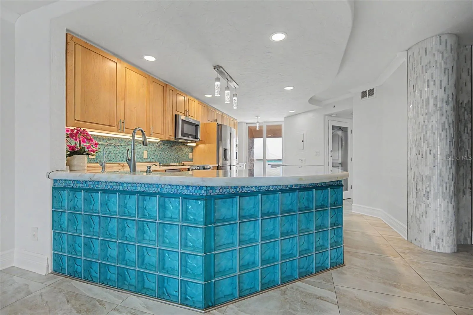 The Contemporary Kitchen with glassed breakfast bar!