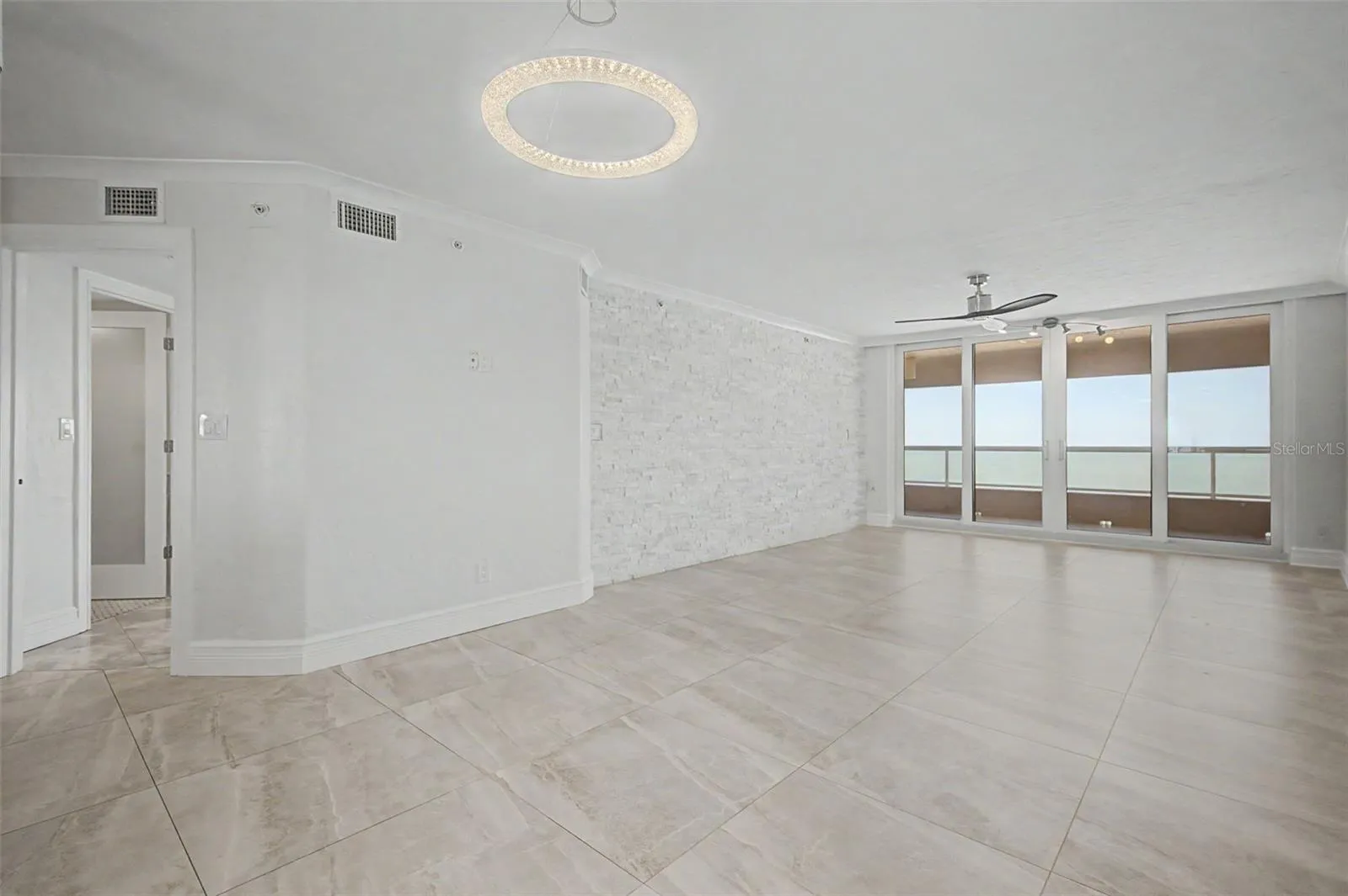 Large Living / Great room with Sliders leading to the Gulf front Balcony