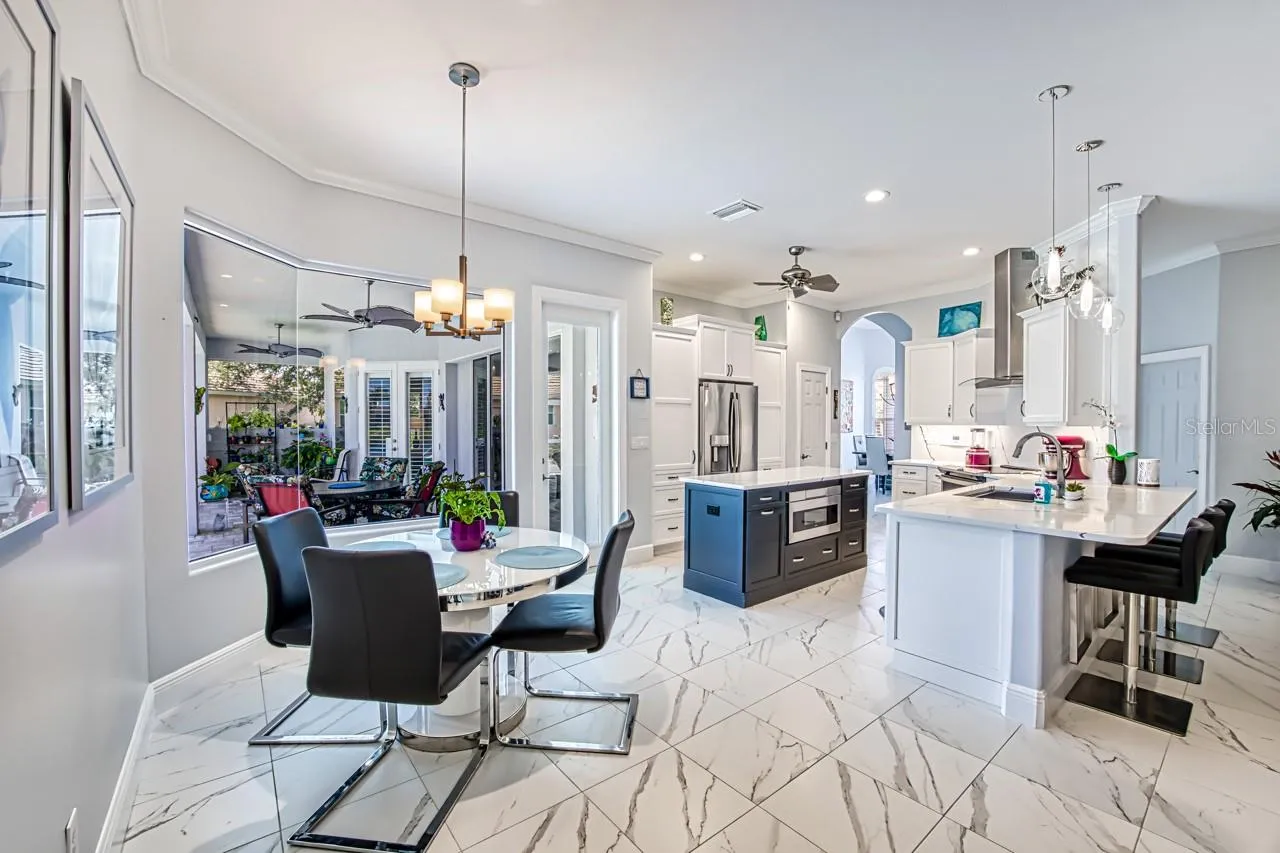 Dinette in Kitchen/Family room area.  Tile floor throughout the home.  Single height counter with seating