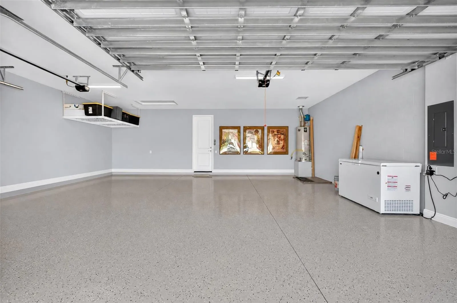 3 car garage with epoxy and overhead storage