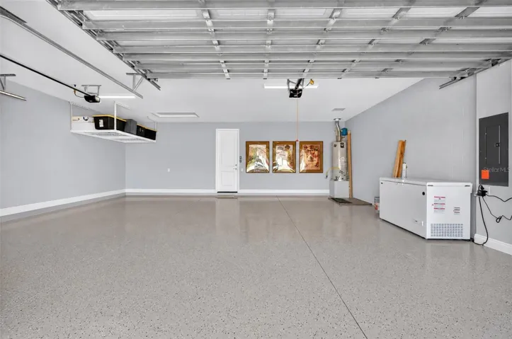 3 car garage with epoxy and overhead storage