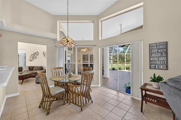 Breakfast nook has sliders to the pool