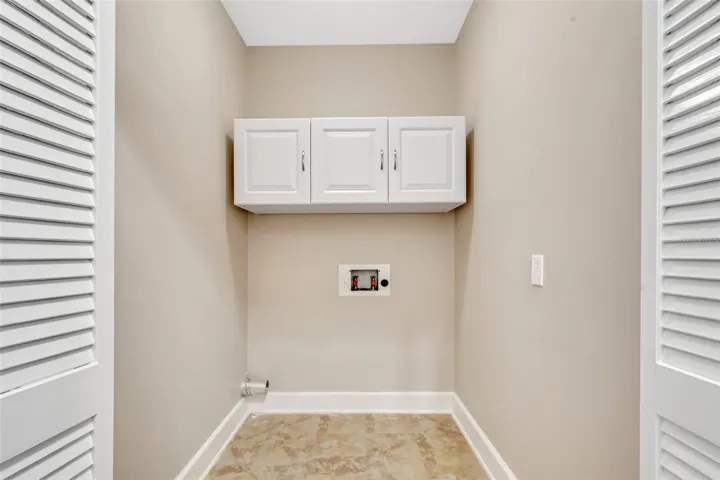 Nice size laundry room with extra storage