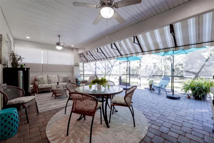 24' x 22' Screen enclosed covered Lanai w/ awning, natural gas connection for a grill &amp; ceiling fans
