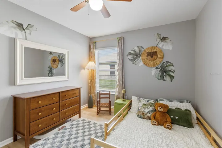 Bedroom with ceiling fan and large closet