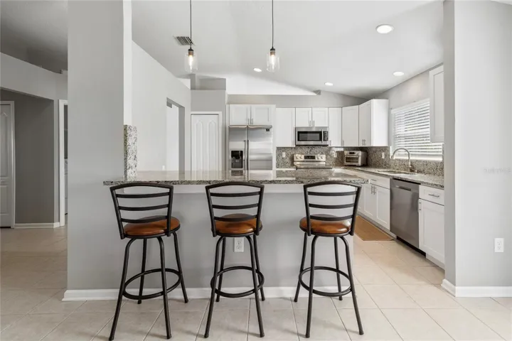 Eat in kitchen with space on both sides of penisular