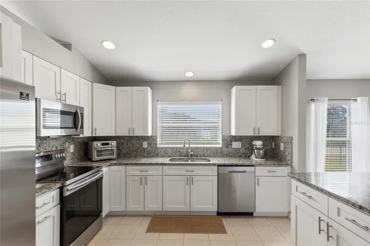 Renovated Kitchen with full slab backsplash