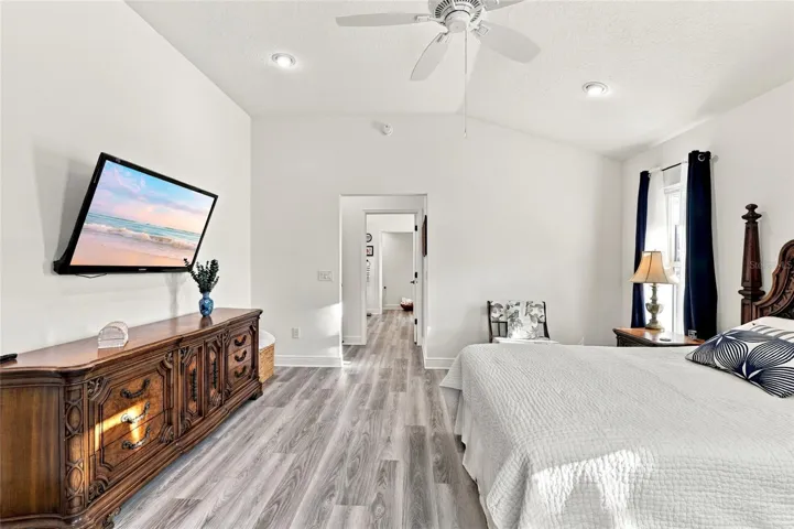 Primary Bedroom with view toward en-suite and closet