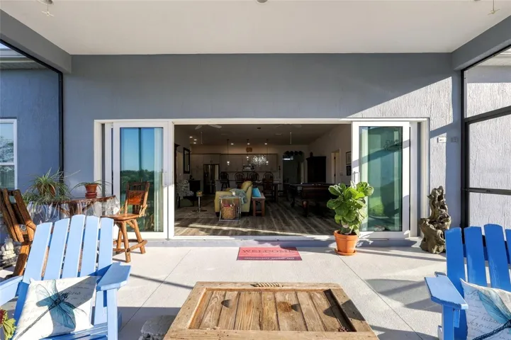 Lanai with 4 Panel Sliders Open to Living Room