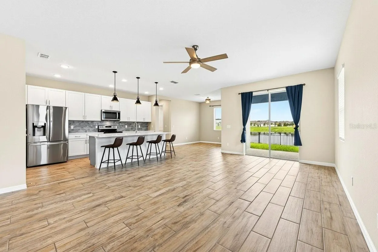 **Virtually Edited** Open-concept living space overlooked by the kitchen