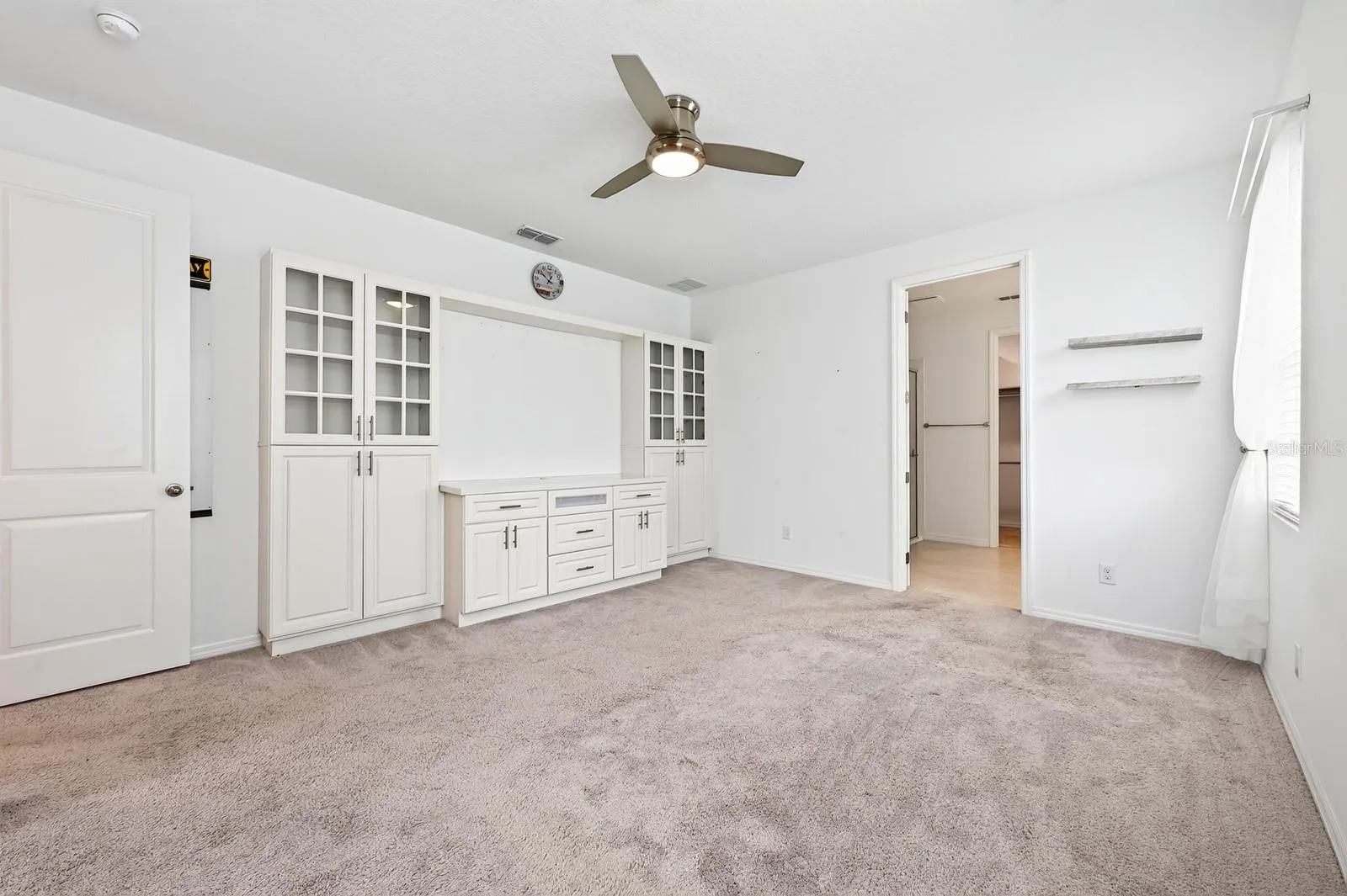 Welcome to your RETREAT! There are incredible built-ins with display space and flexible storage. The opening in the middle is perfect for a TV too!