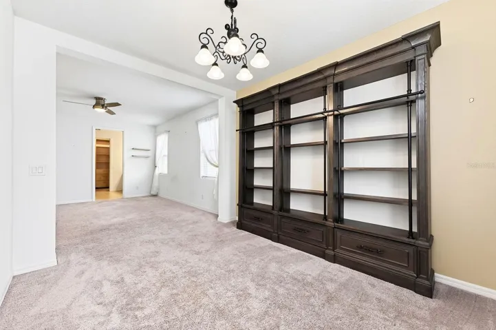 Amazing seating room area in the primary bedroom! You'll love the extra storage and display on the built-in shelves