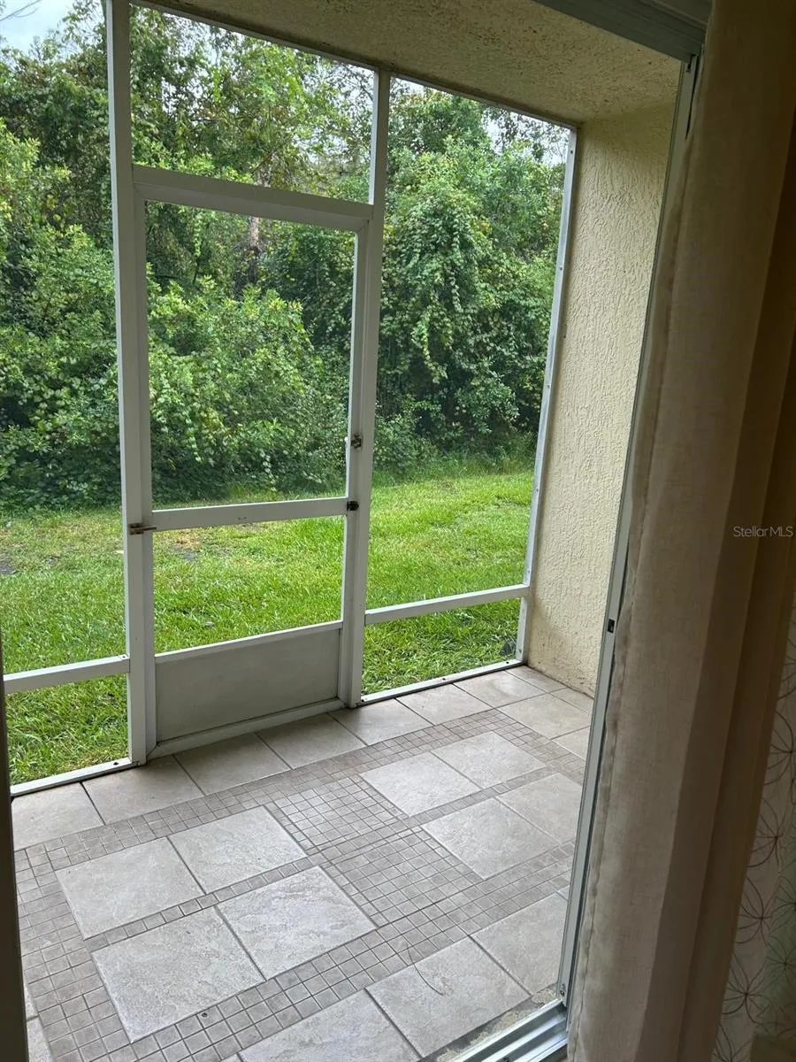 Rear porch covered &amp; screened with conservation views
