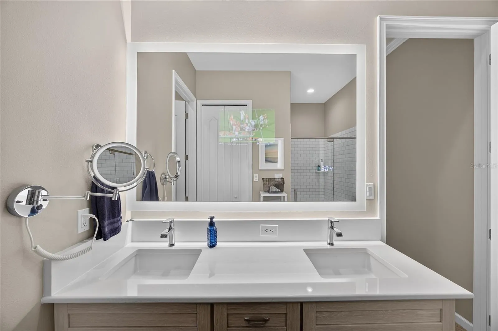 Seura Lighted Mirror includes TV.