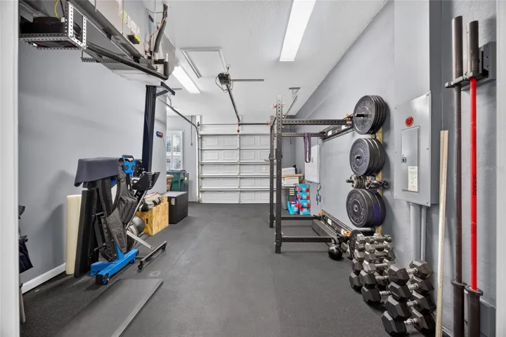 Oversized one-car garage built-out as a gym.