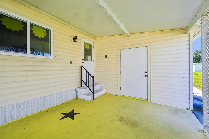 Covered carport with storage/laundry