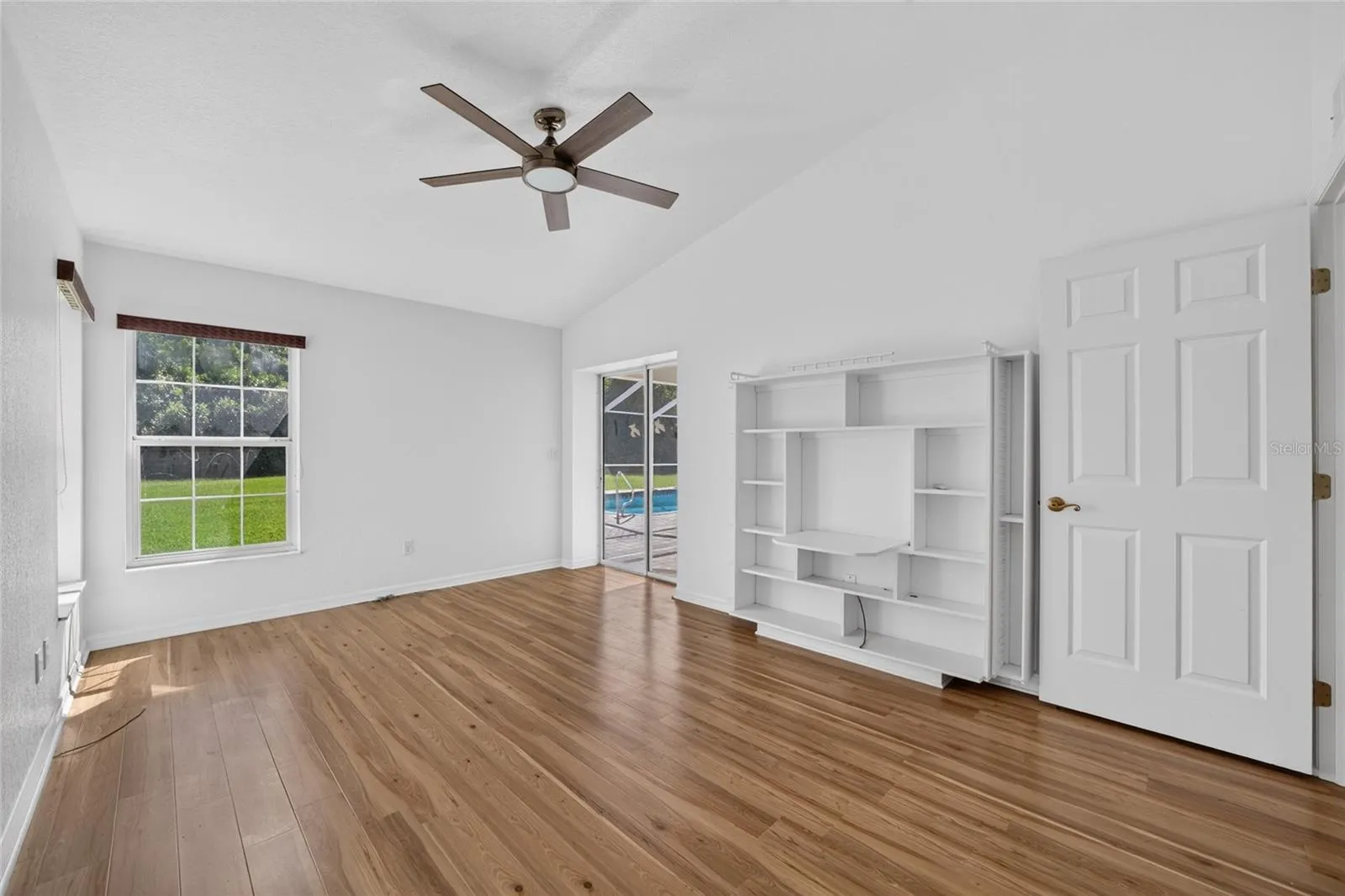 3rd bedroom with it's own pool access and walk in counter. Great room for den or work at home space
