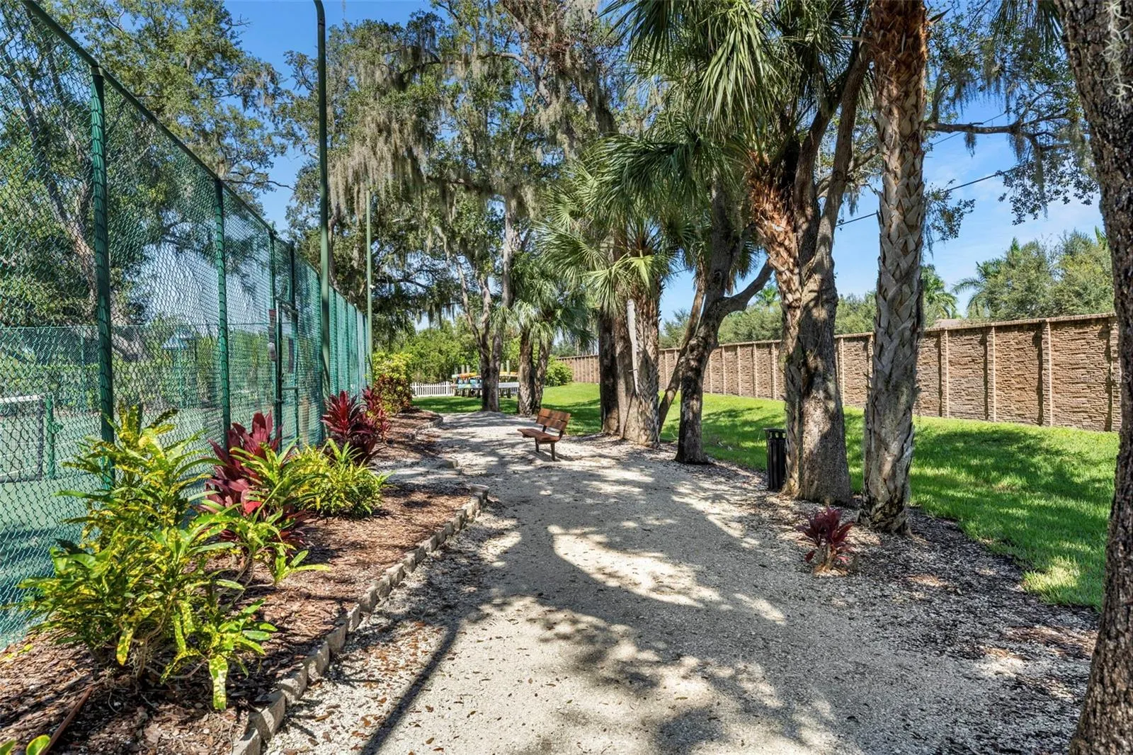 Tree-lined community paths offer a lovely setting for a morning stroll or a quiet afternoon outdoors.